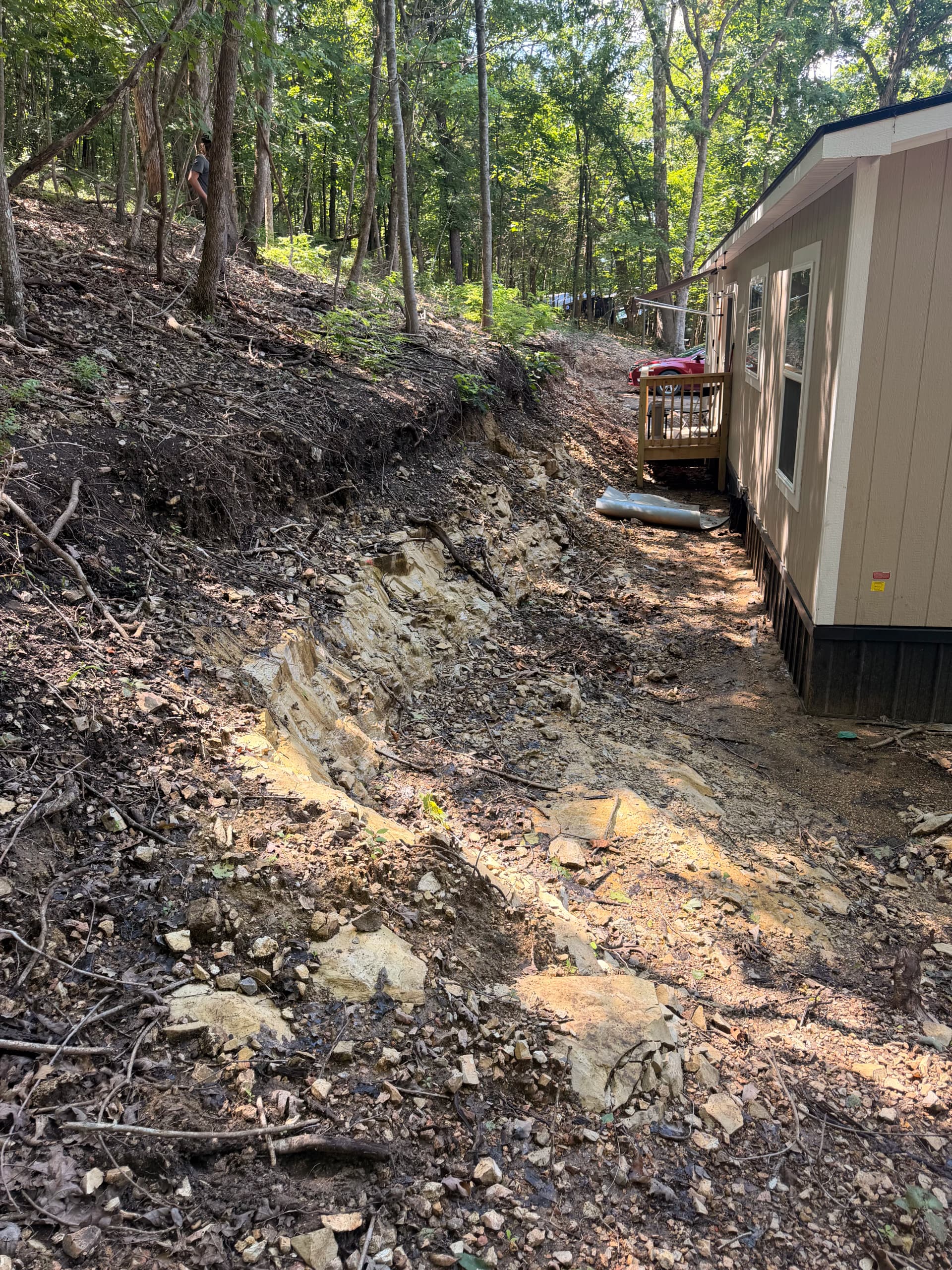 Gallery photos for From Mudslide Risk to Solid Retaining Wall in NWA: Image #1